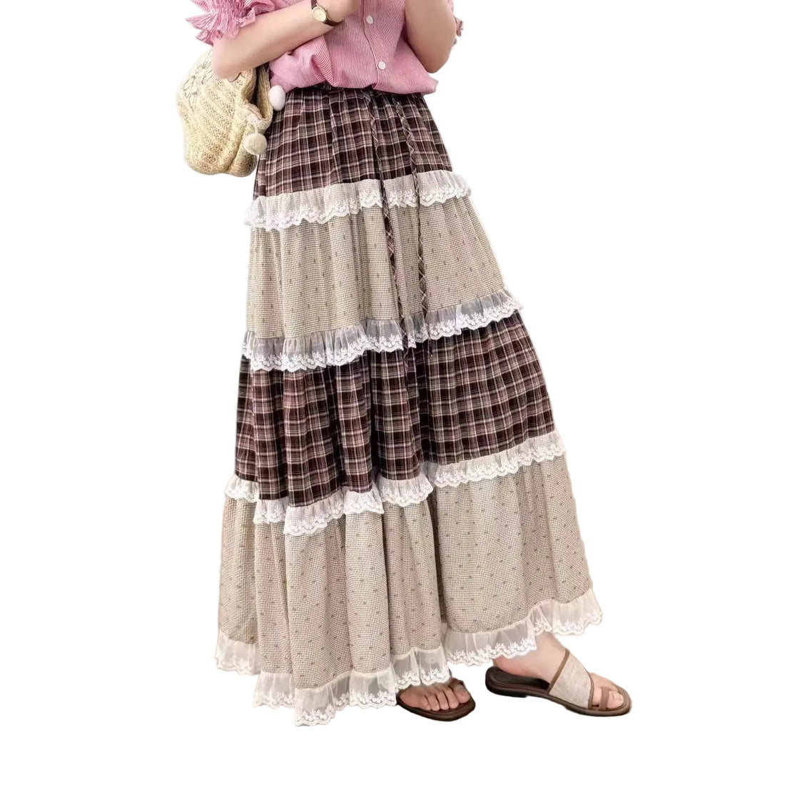 Long, tiered skirt with plaid and lace details worn by a person indoors.