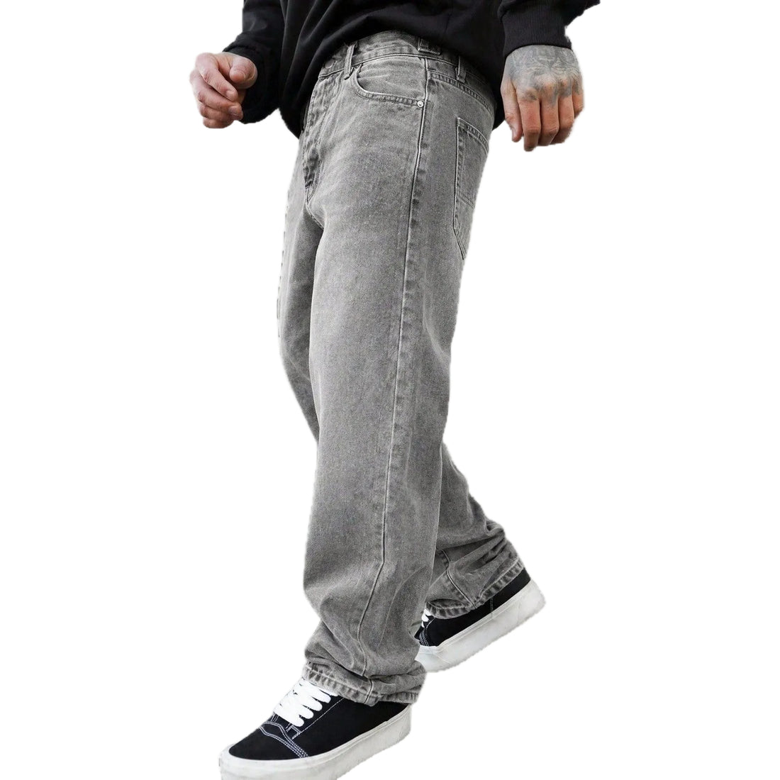 A person wearing light gray washed denim jeans with a black long-sleeve top and black low-top sneakers, shown from the waist down against a plain white background.
