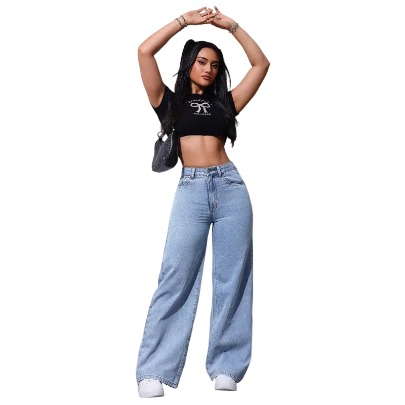 Person wearing a black crop top and light blue jeans on a white background