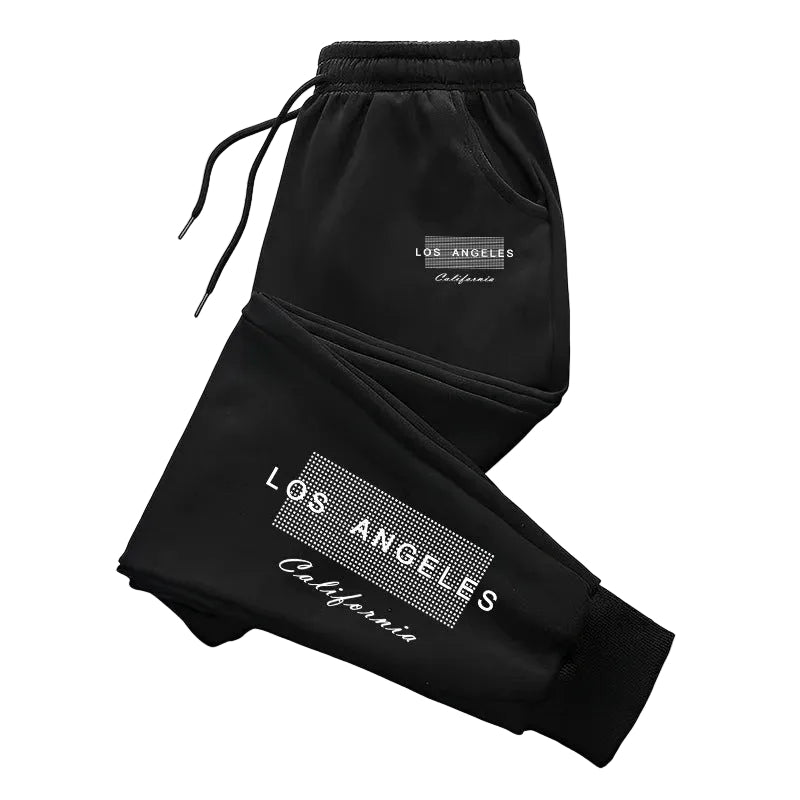Black sweatpants with 'Brooklyn New York' text on a white background