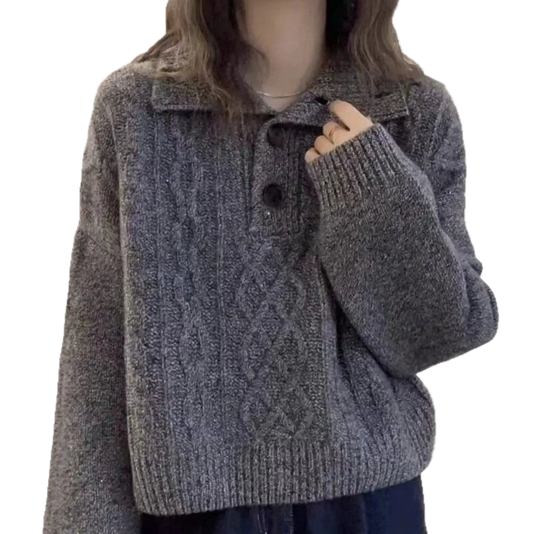A person wearing a chunky gray cable-knit cardigan sweater with a collar and two dark buttons, shown against a plain white background.