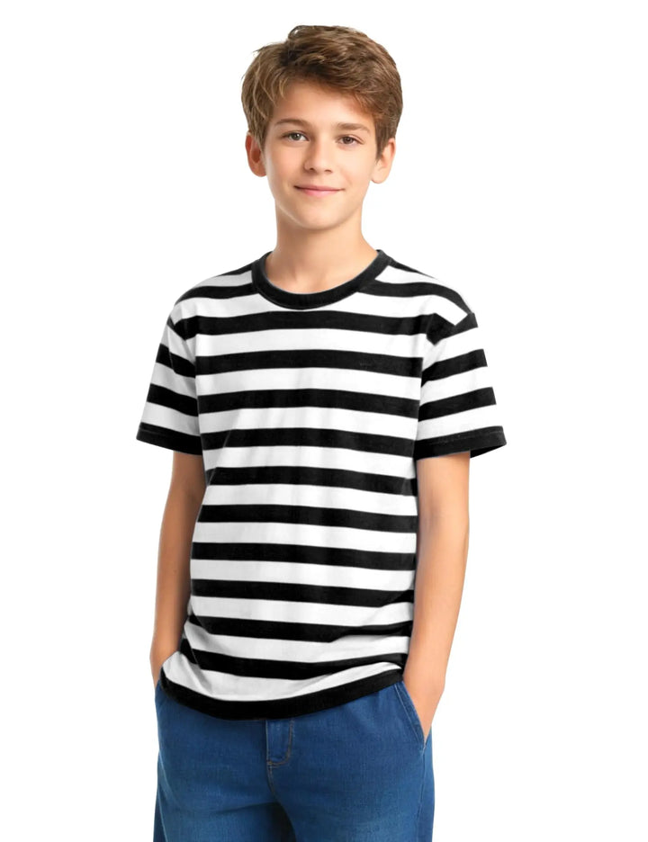 A young boy wearing a black and white horizontally striped short-sleeve t-shirt with black trim, paired with blue jeans, standing against a plain white background.
