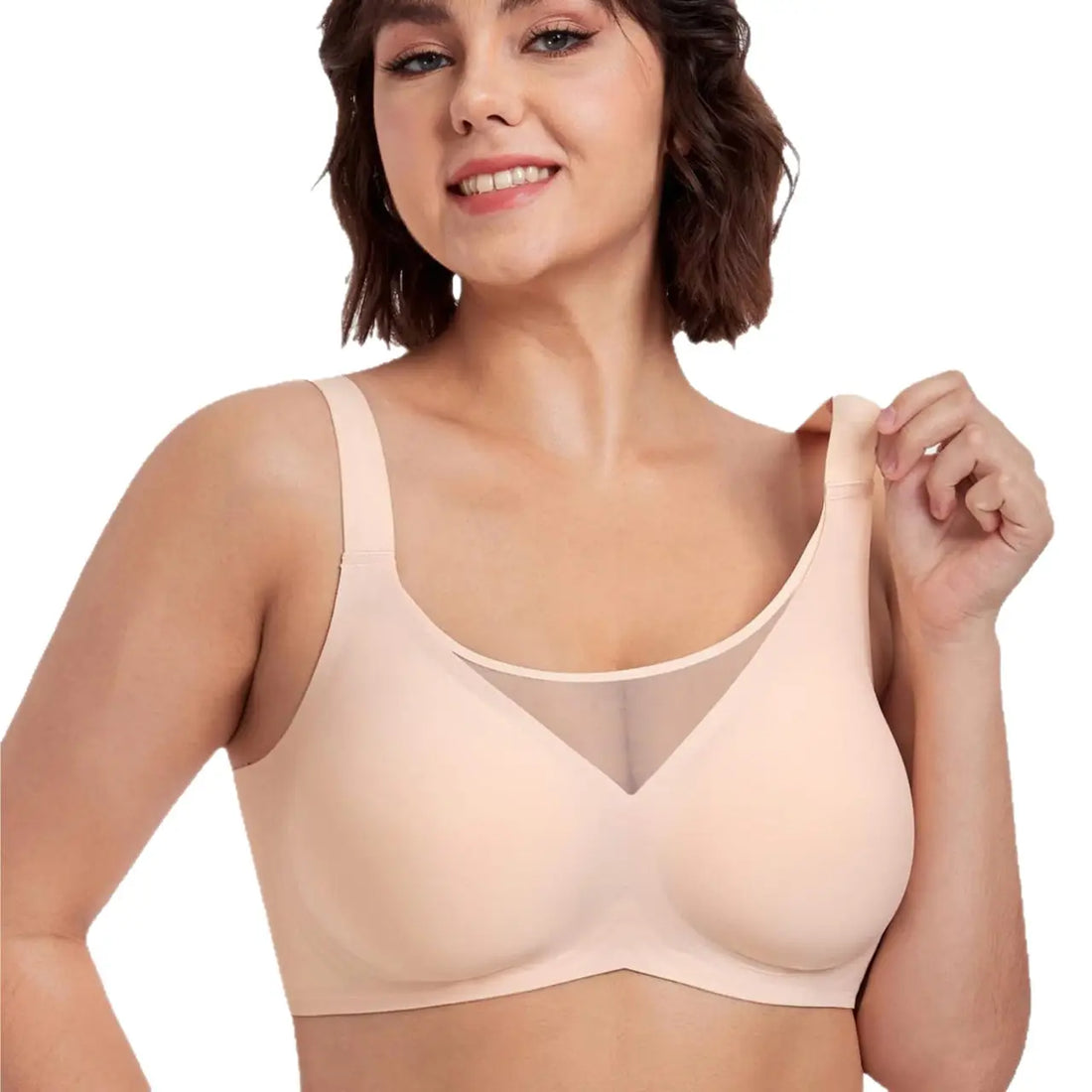 Woman wearing a beige bra on a white background