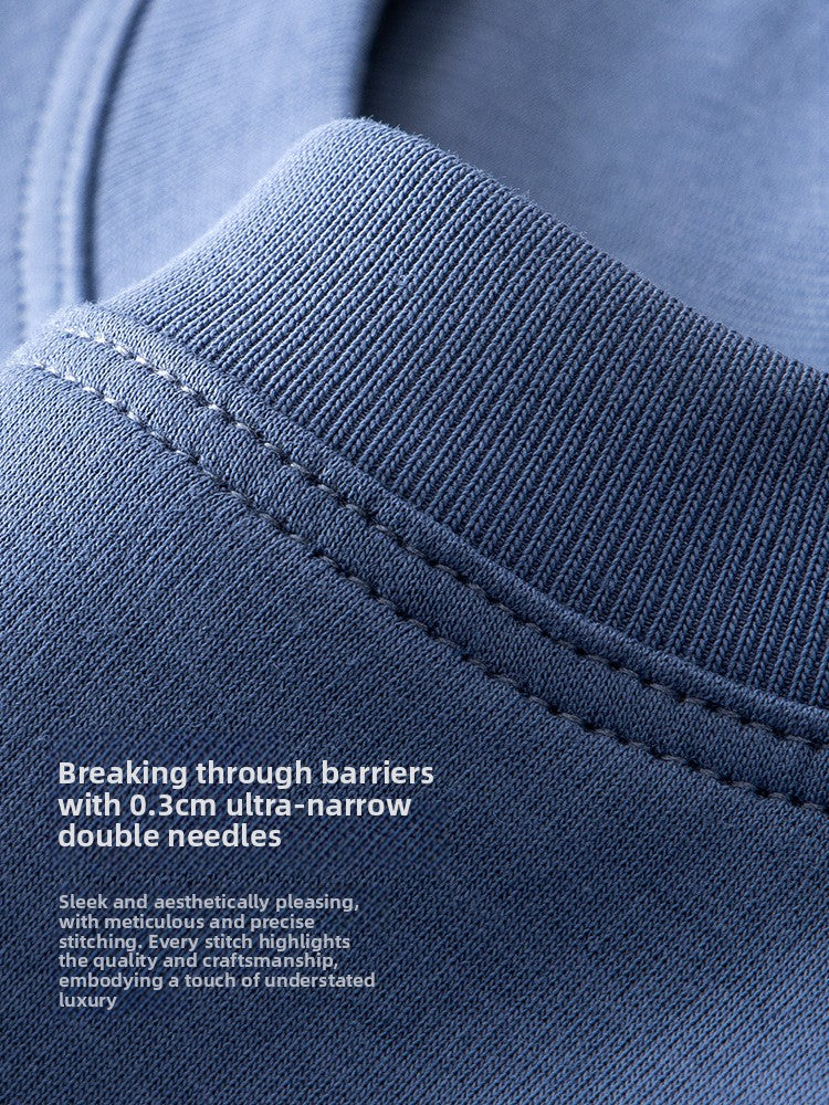 Close-up of a blue ribbed knit fabric with a folded collar and white text overlay describing stitching detail.