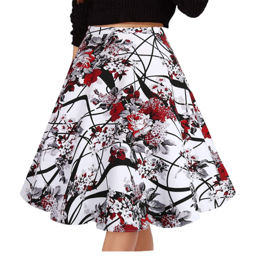 A high-waisted A-line skirt with a white base and a bold abstract floral print in red, black, and gray, shown on a model wearing a black knit top against a plain white background.