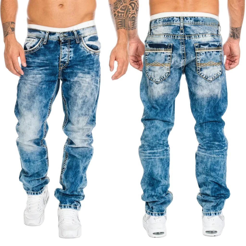 Front and back views of a person modeling blue acid-wash denim jeans with white sneakers against a plain white background.