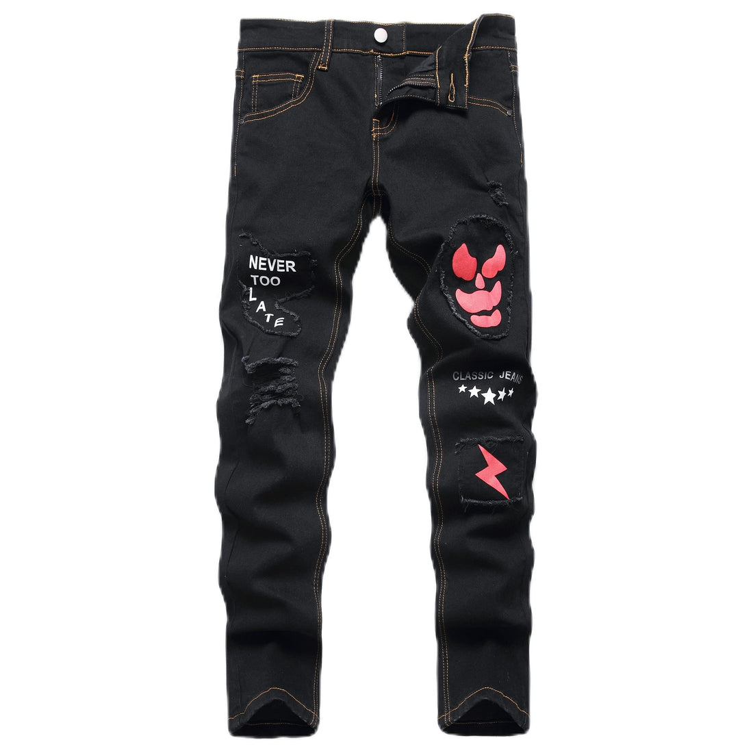 Black distressed denim jeans with ripped details, featuring a red devil face patch on the right thigh, white text patches, and a red lightning bolt patch on the left leg, shown against a plain white background.