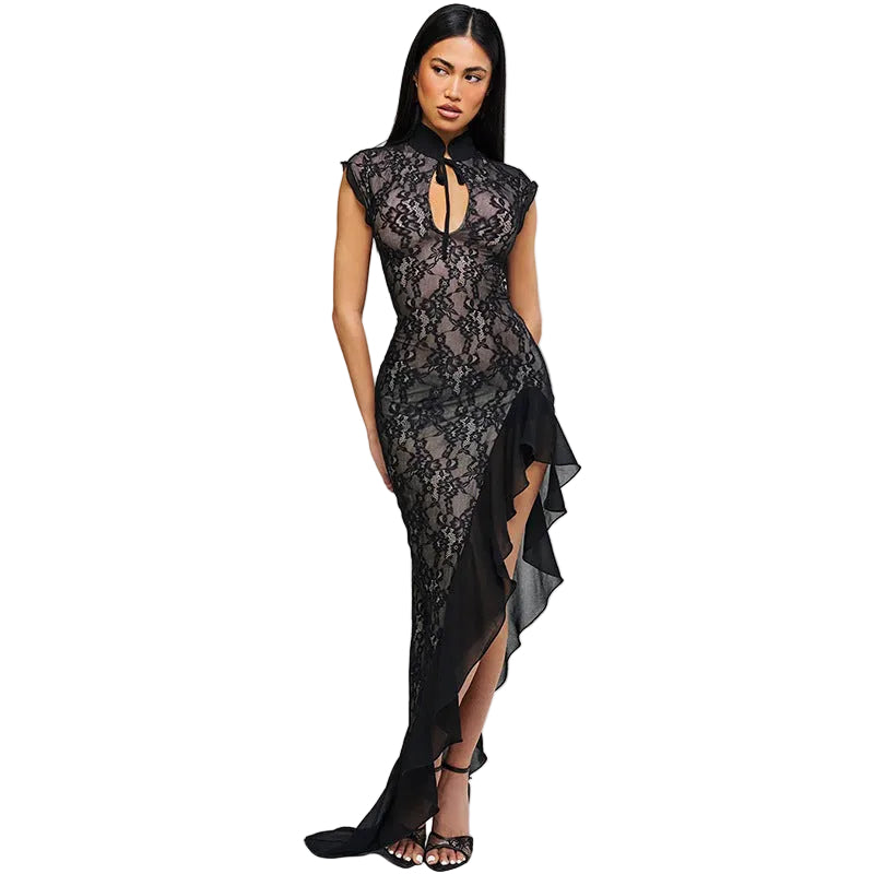 Woman wearing a black lace dress on a gray background
