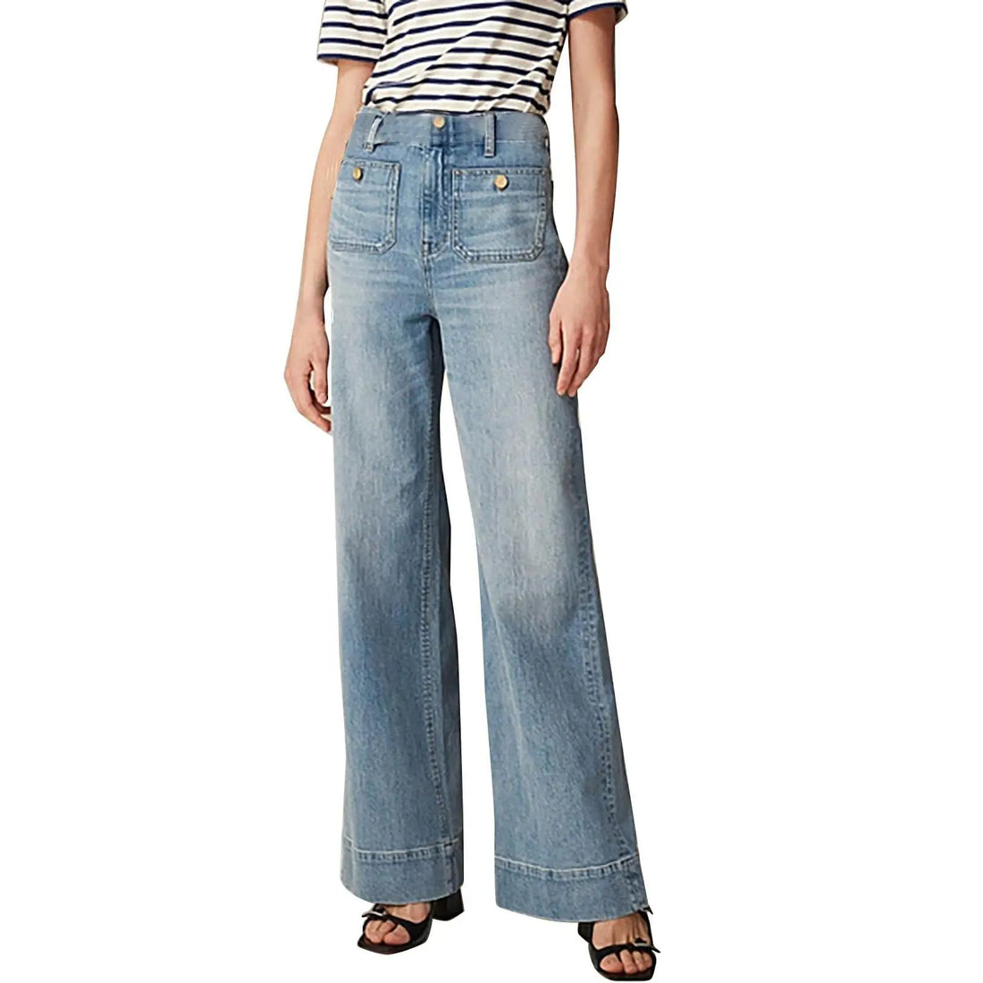 Person wearing light blue jeans and a striped shirt on a white background