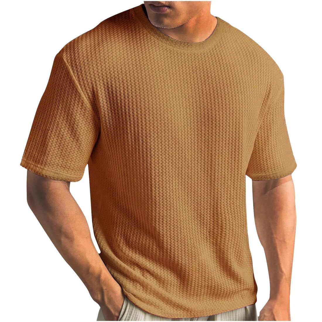 A man wearing a short-sleeve waffle-knit crewneck t-shirt in a warm tan or camel color, shown from the neck down against a plain white background.