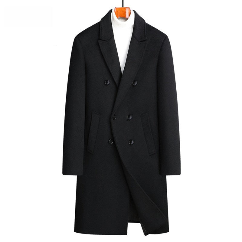 A black double-breasted overcoat displayed on a hanger with a white turtleneck underneath, set against a plain white background.