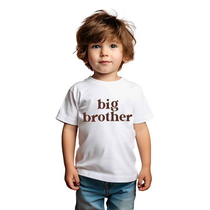 Child wearing a white t-shirt with 'big brother' text on a white background