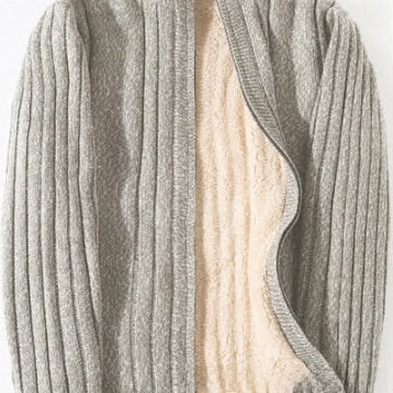 A close-up of a ribbed knit cardigan in a heather gray color, showing a soft cream-colored lining.