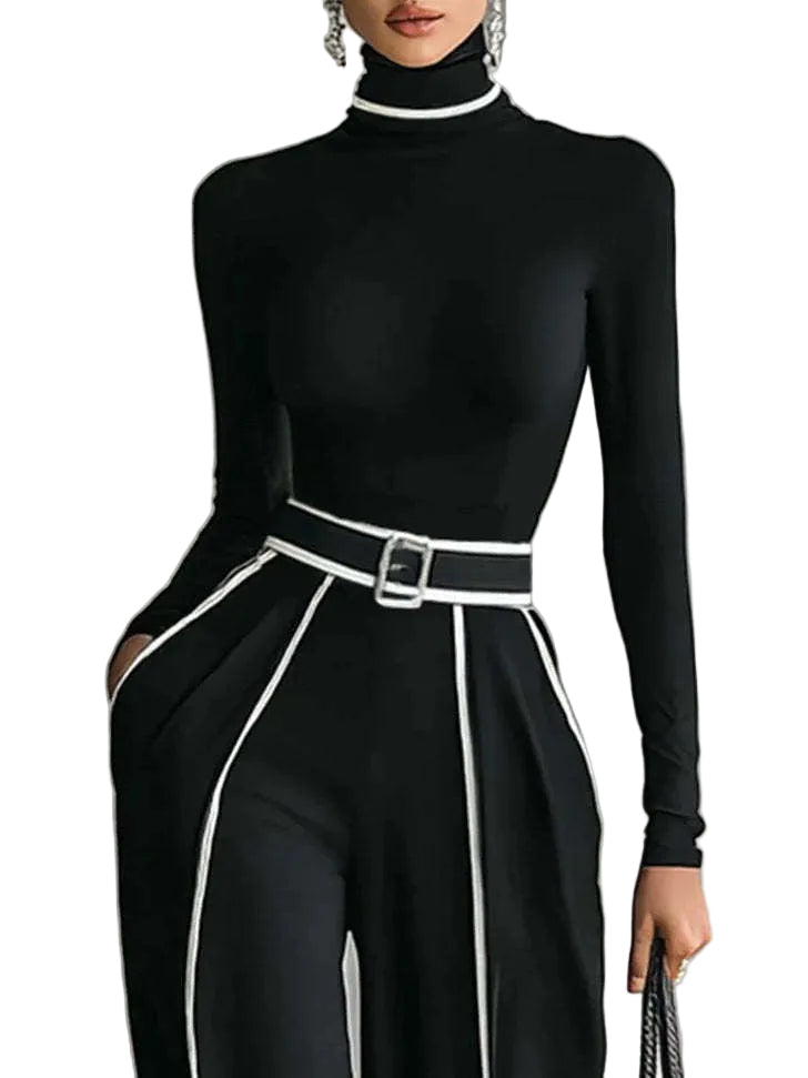 Black turtleneck jumpsuit with white trim on a gray background