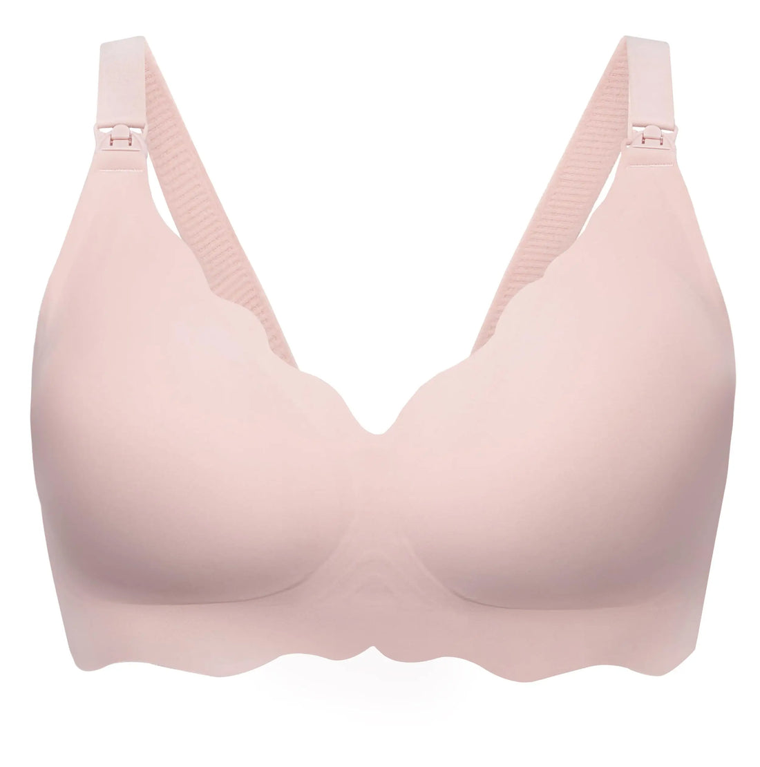 A light pink seamless wireless bra with adjustable shoulder straps and scalloped edges, shown on a plain white background.