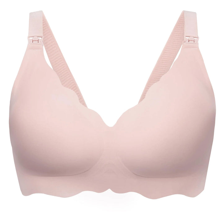 A light pink seamless wireless bra with adjustable shoulder straps and scalloped edges, shown on a plain white background.