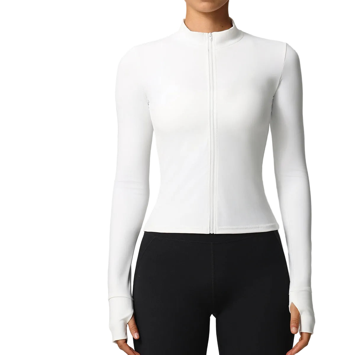 A woman wearing a fitted white long-sleeve zip-front athletic top with a mock neck, paired with black leggings, shown against a light gray studio background.