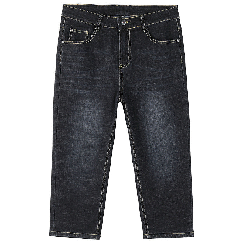 Dark wash blue denim jeans with light contrast stitching, shown flat against a white background.