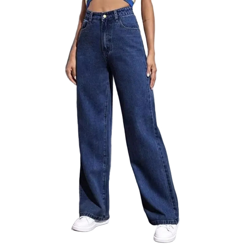 Person wearing blue wide-leg jeans and white sneakers on a plain background