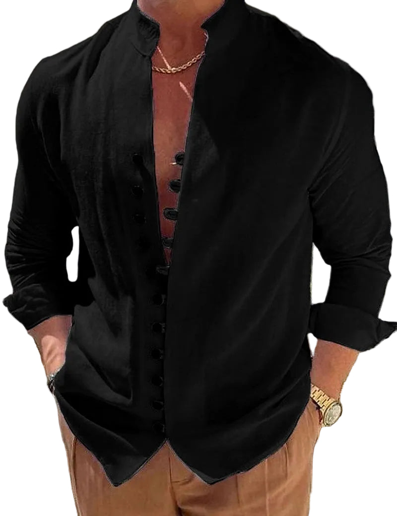 Person wearing a black shirt with rolled-up sleeves and brown pants outdoors.