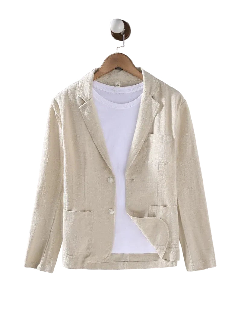 A light beige linen-blend blazer jacket with notch lapels and front buttons, styled over a white t-shirt on a wooden hanger against a textured gray wall.