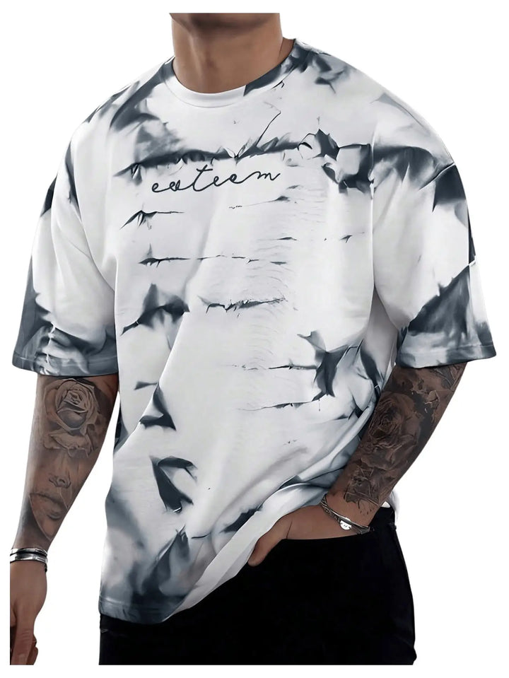 A man wearing a white short-sleeve t-shirt with a black and gray bark-like abstract print and the word 'extrem' written across the chest, shown against a plain white background.