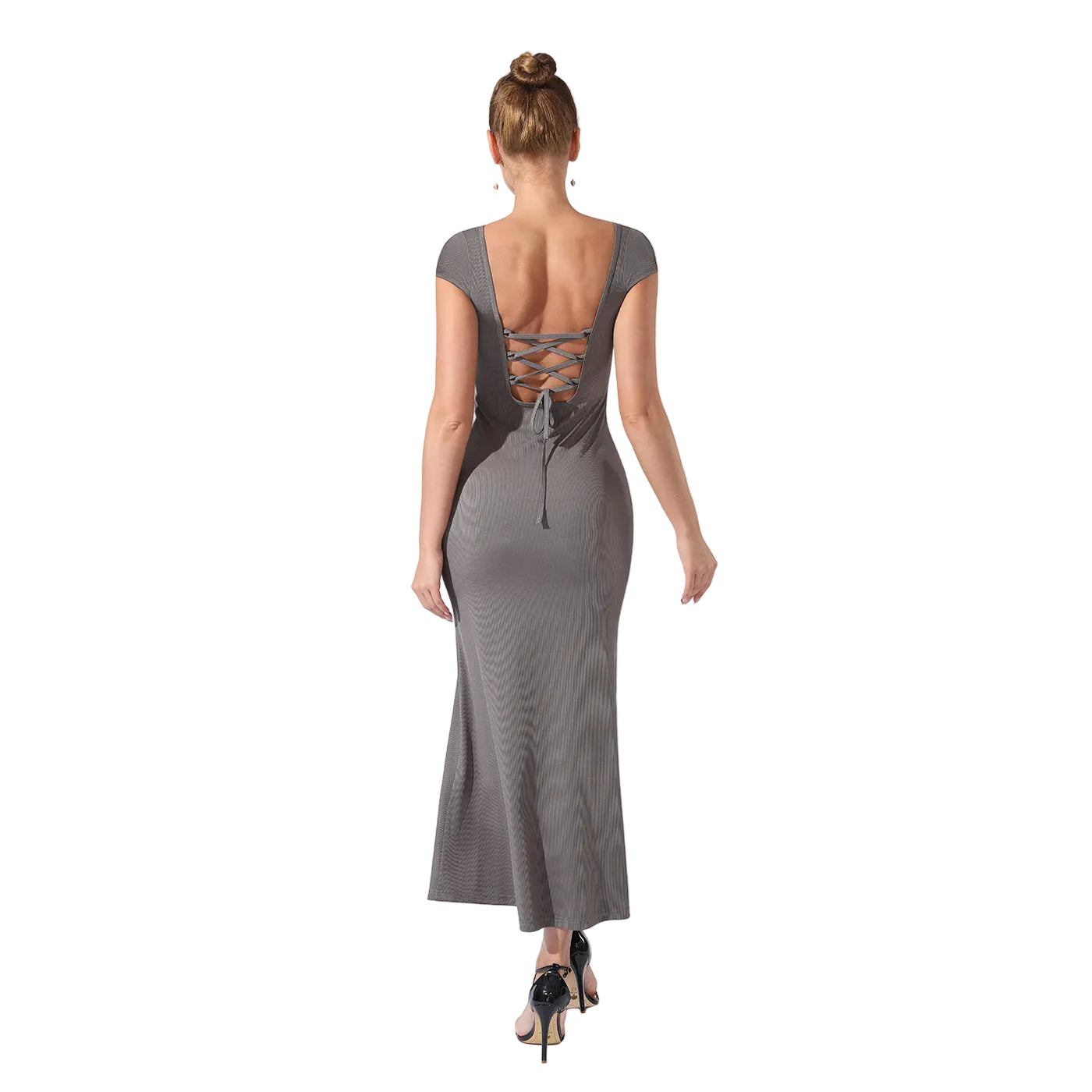 Woman wearing a gray dress with a back design on a white background