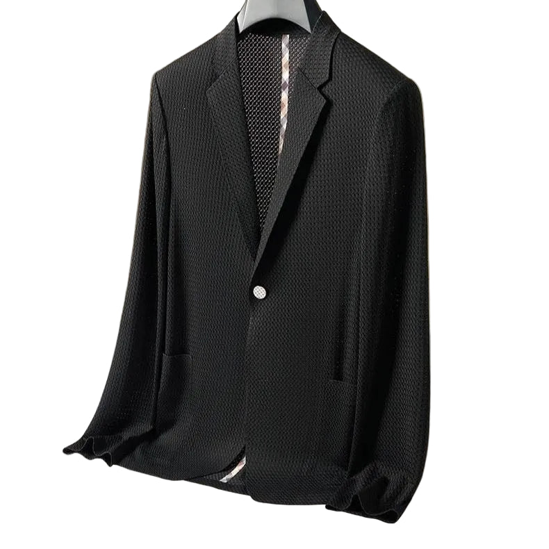 A black textured long-sleeve blazer with a single-button closure, displayed on a hanger against a beige background.