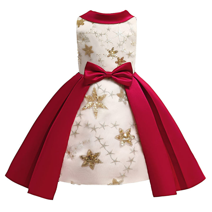 Dress with red cape and gold star patterns on a white background