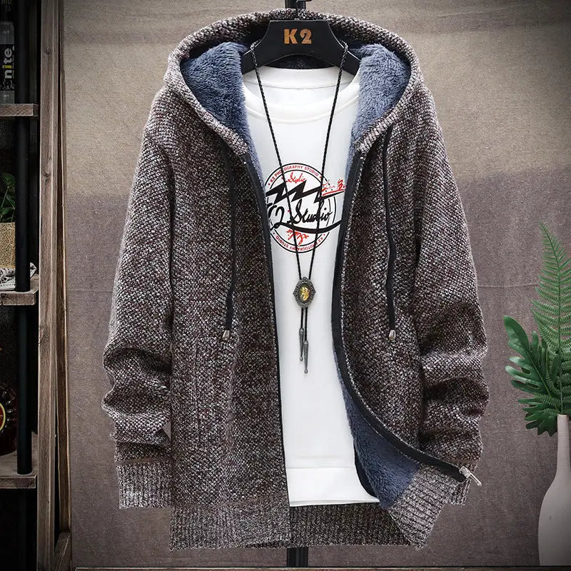 Brown hooded jacket on a hanger with a white shirt underneath, against a neutral background.