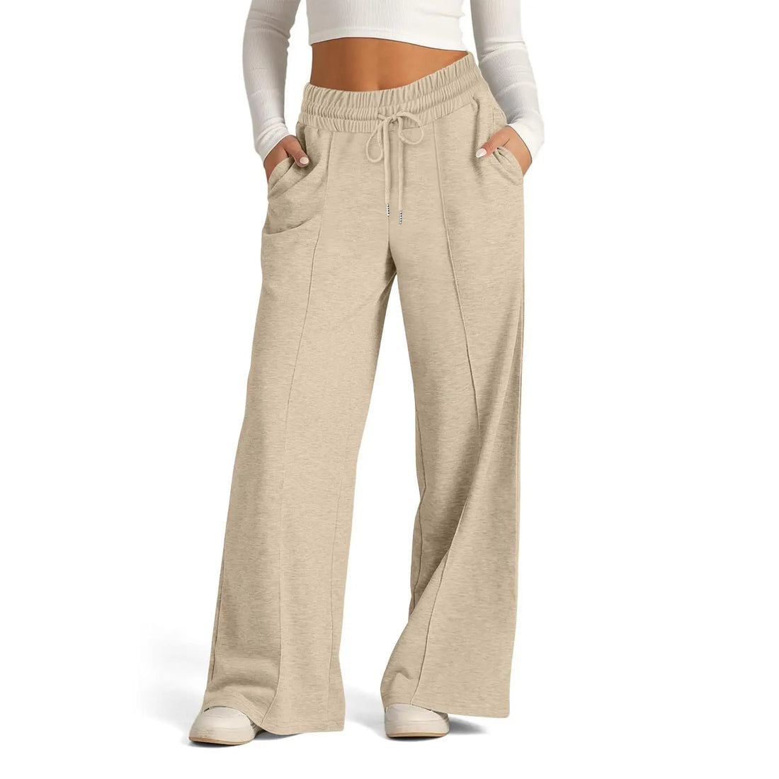 Beige wide-leg pants worn by a person on a white background