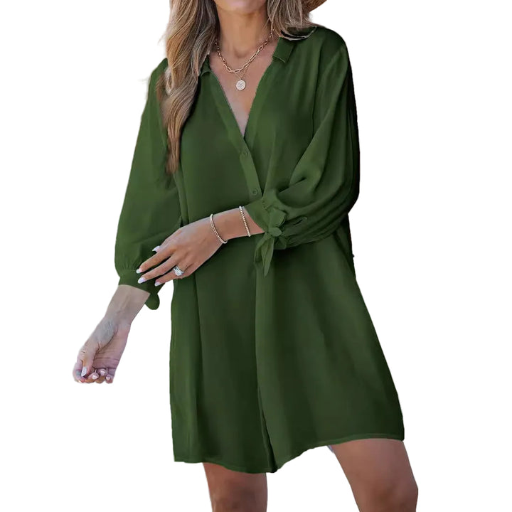 Woman wearing a green dress with a wooden wall background