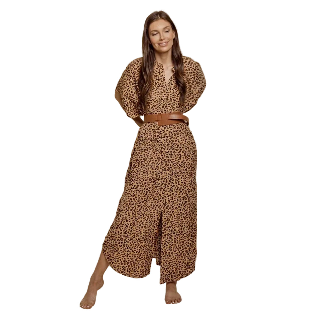 Woman wearing a leopard print outfit with a belt on a beige background