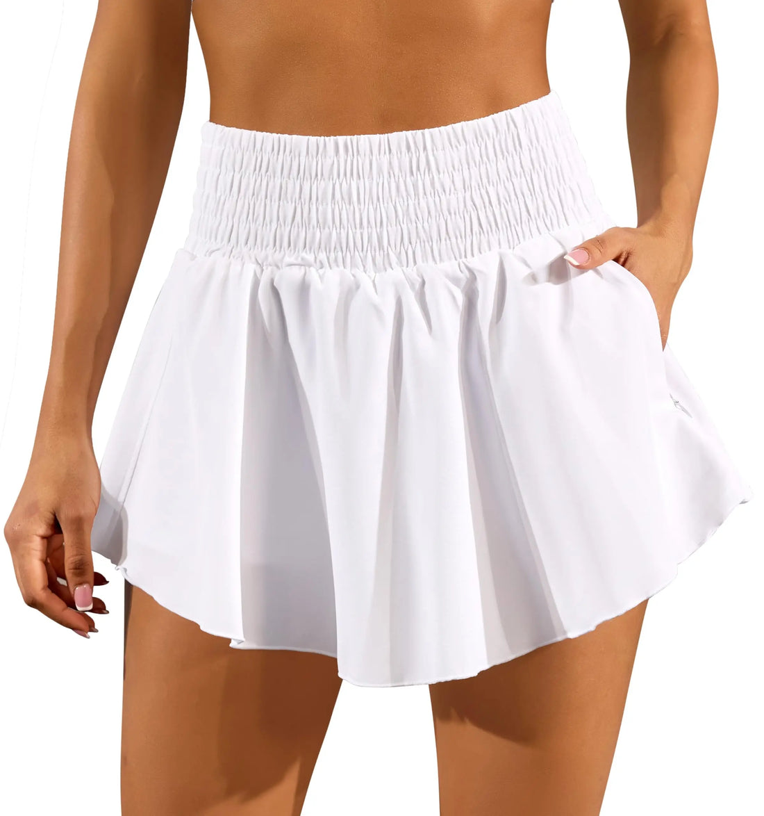 White skirt worn by a person on a white background